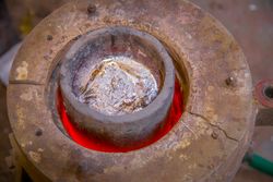 Metal ware heating in crucible