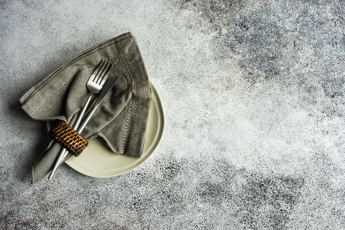 Grey table setting on concrete background