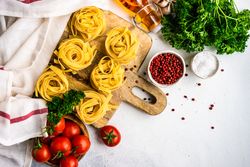 Top view of ingredients for pasta dish on counter with copy space