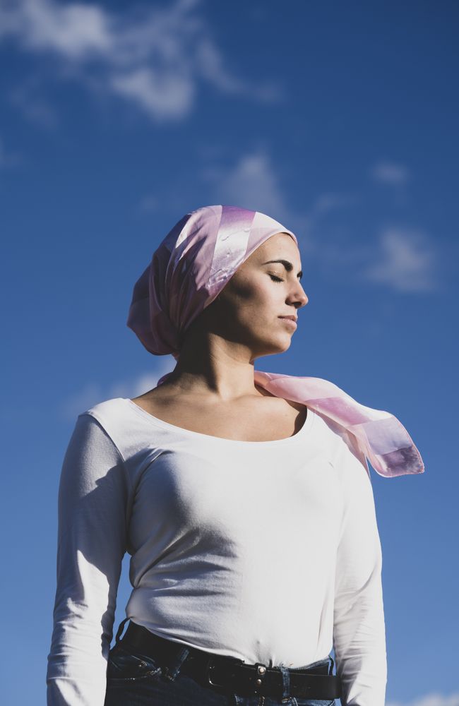 Young woman with cancer bandana