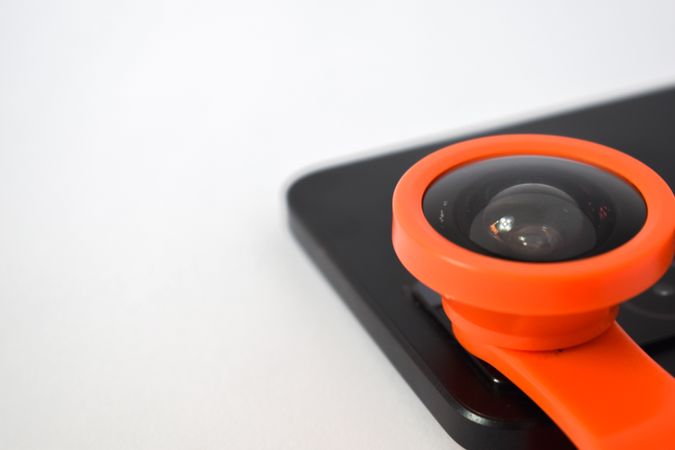 Close up of snap on lens add on on smartphone camera with copy space
