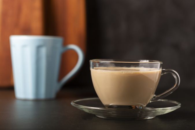 Cup of coffee with creamy milk.