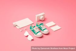 Back to school supplies with pink sneakers on pink background 4MgVr0