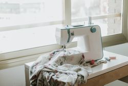 Modern sewing machine near window