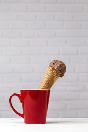 Chocolate ice cream cone in red cup