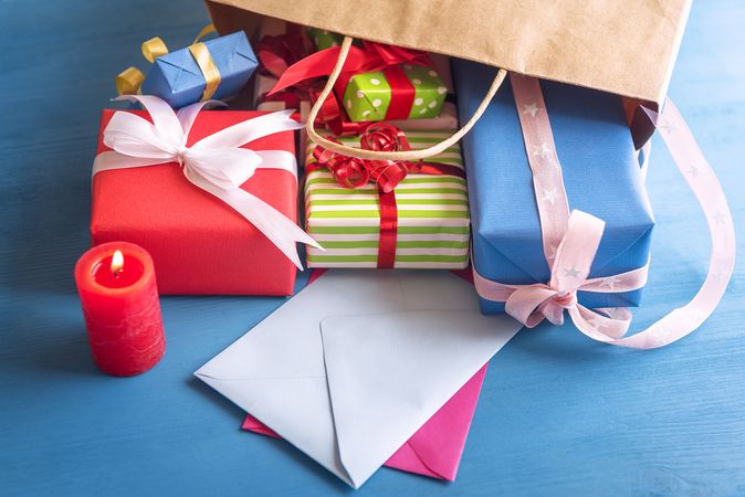 Colorful presents on blue table
