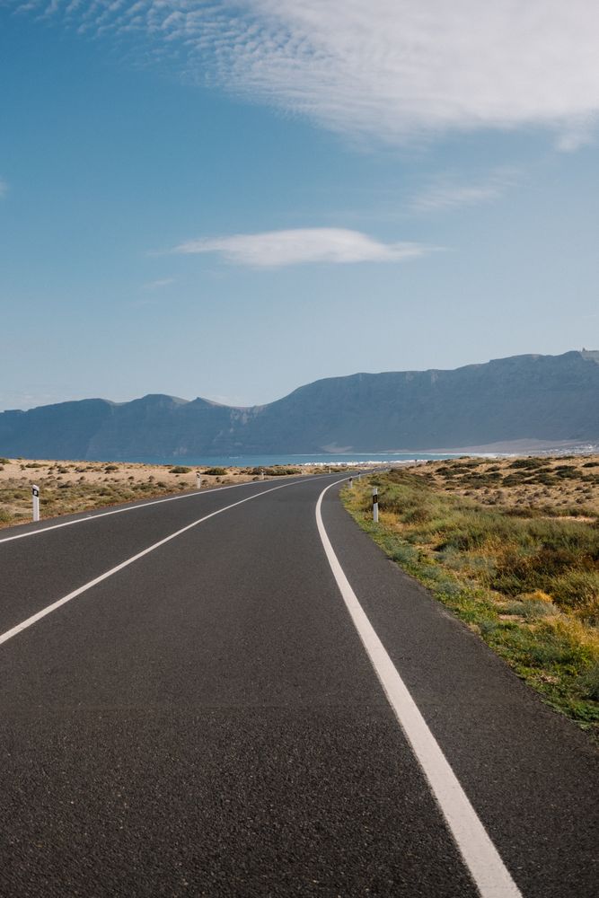 Road leading to a beach on quiet day