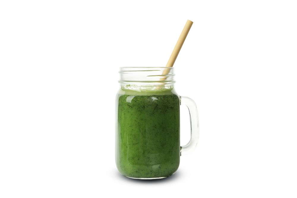 Smoothie of green vegetables isolated on blank background