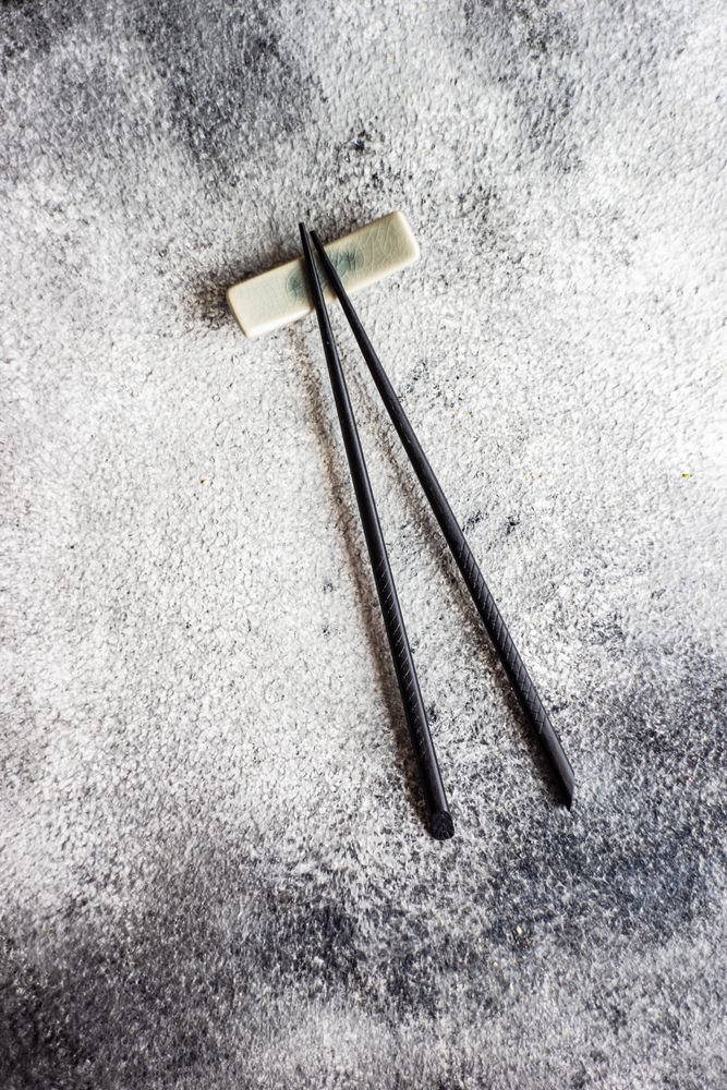 Asian table setting with chopsticks on grey counter