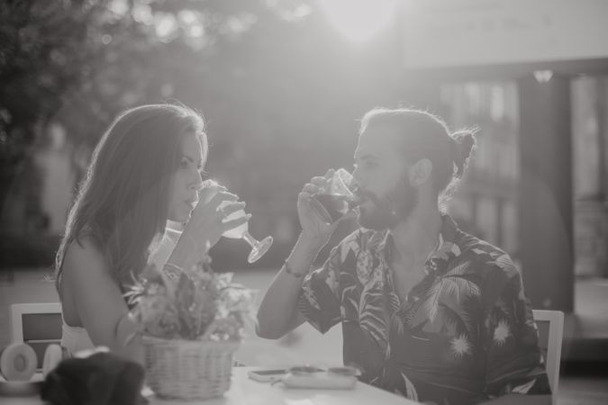 Loving couple clinking glasses on cafe terrace