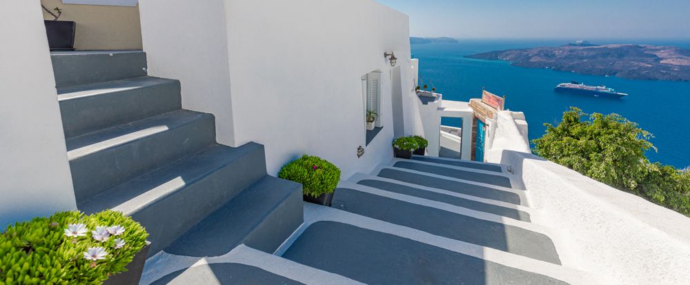 Stairs in Santorini leading down to cruise ship