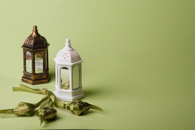 Decorative Lanterns and Ribbons on Pastel Background for Eid Celebration
