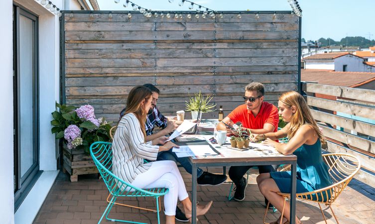 People working on the terrace of the office