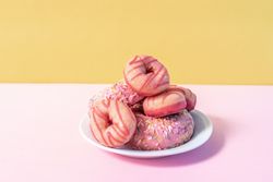 Pink doughnuts in a colorful background