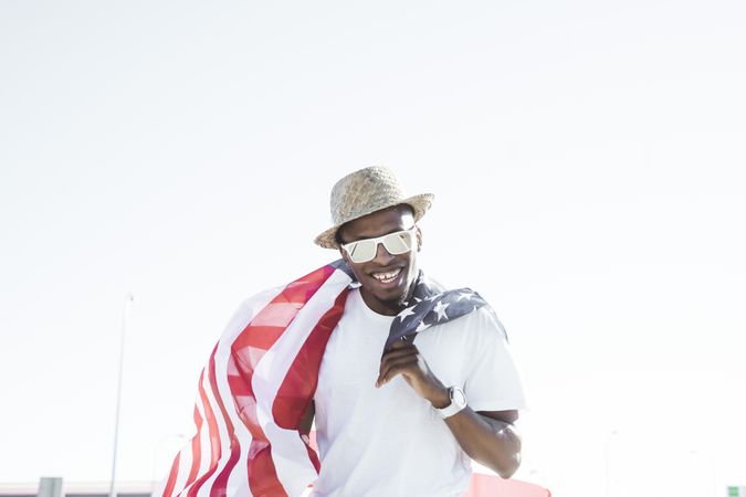 Cheerful black man with American flag