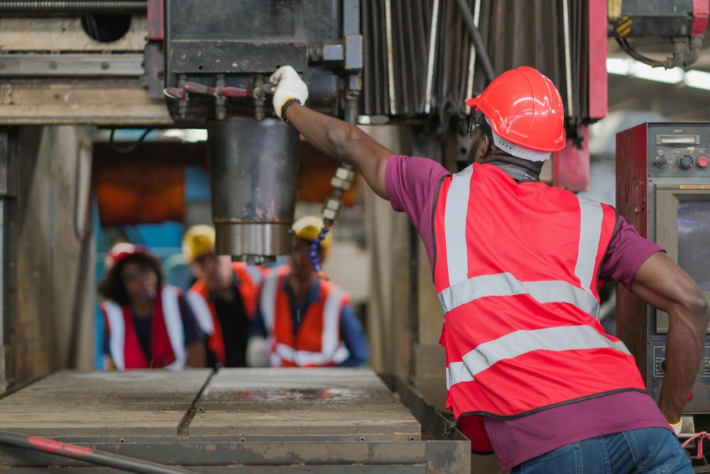 Mechanic team working together in manufacturing