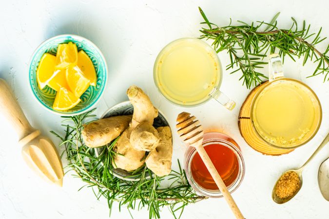 Top view of ginger detox drinks with citrus and honey