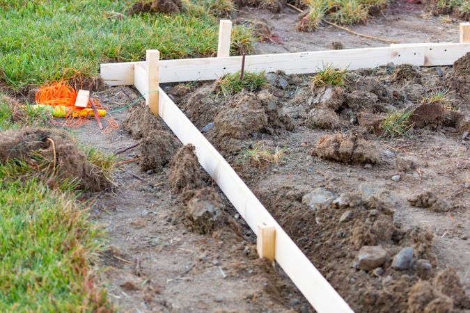 Guides and Stakes In Ground At Construction Site