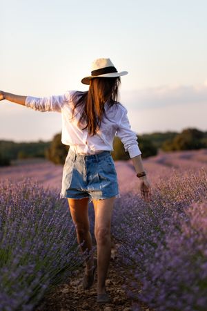 Woman walking in lavender field