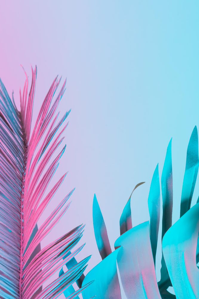 Tropical and palm leaves in vibrant bold gradient holographic colors