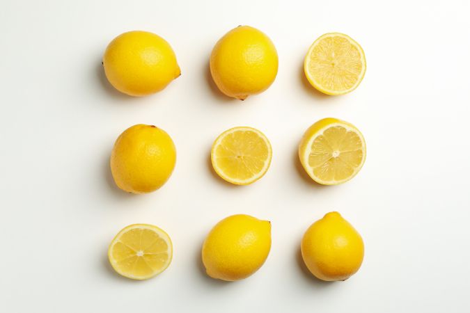 Flat lay with lemons on light background. Fresh fruit