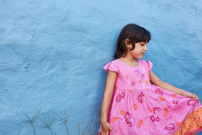 Shot of little girl in beautiful pink dress