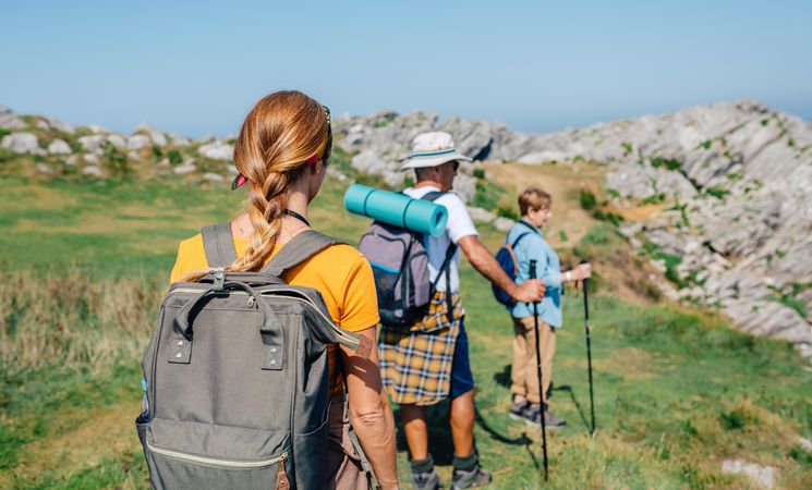 Back of hikers descending a hill
