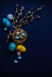 Top view of blue table and bird's nest for Easter card concept