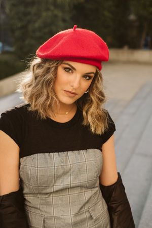 Stylish female in beret looking at camera