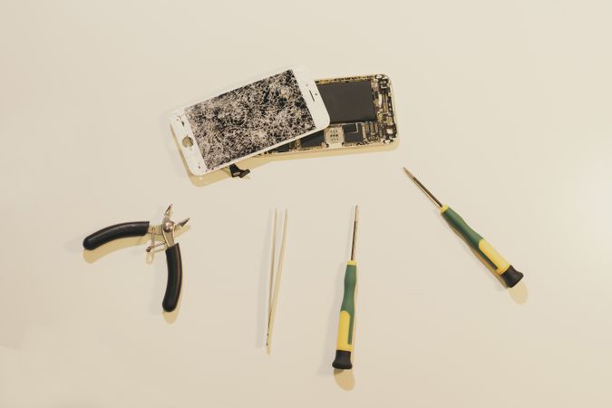 Repair tools near broken smartphone