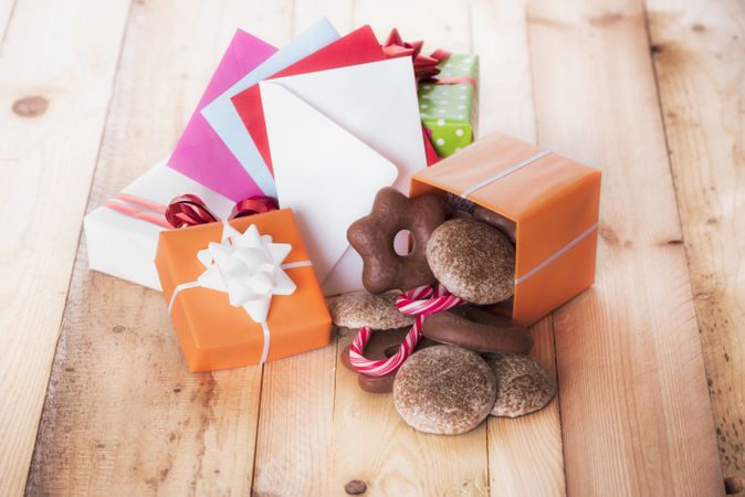 Gifts and envelopes on wooden table