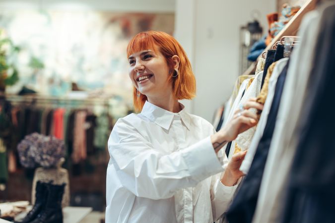 Smiling shopper in clothing store