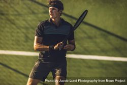 Pro tennis player practicing tennis on a club court 48kWK5