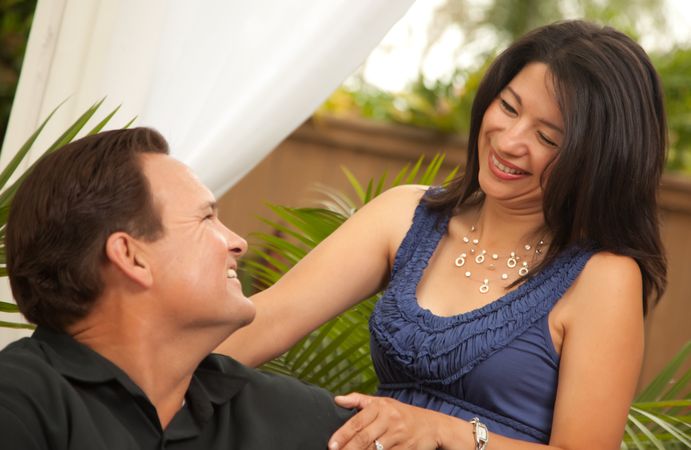 Loving Couple In Front Of Fern