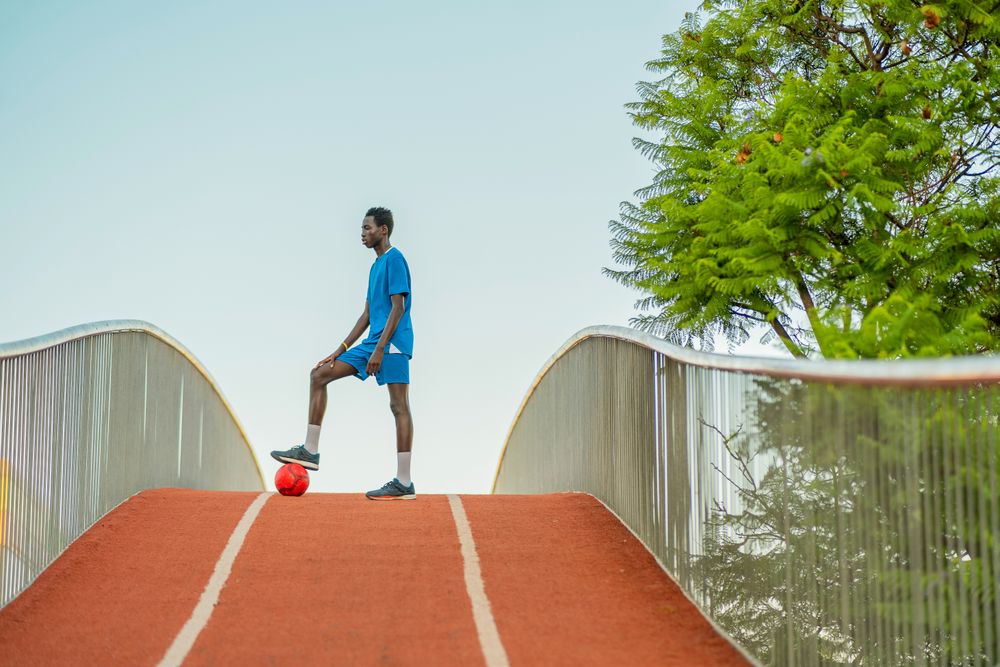 Black football player standing on path