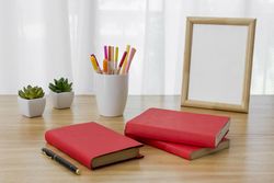 Arrangement with books on desk