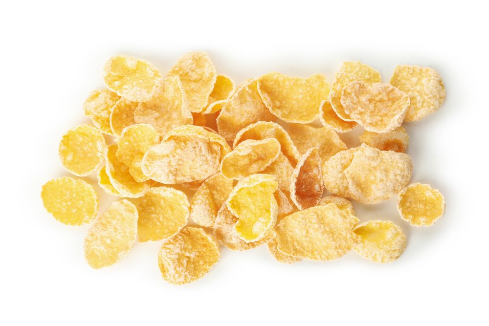 Tasty muesli isolated on plain background, close up