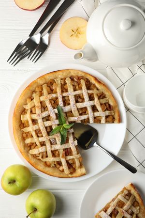 Composition with apple pie on wooden background. Tasty lunch. Homemade breakfast