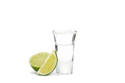 Tequila shot with lime and salt isolated on blank background