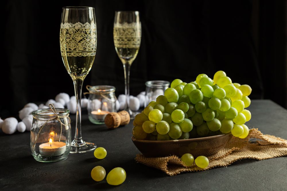 Glasses with wine and grapes