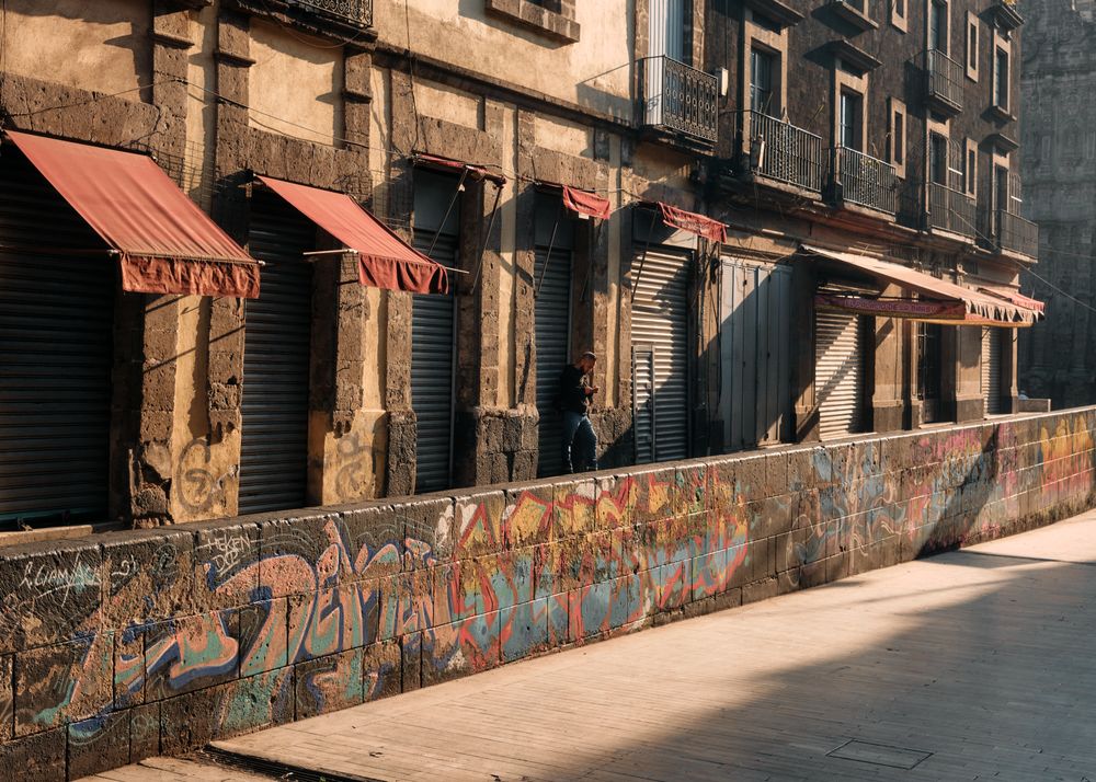 Closed shops with red awning