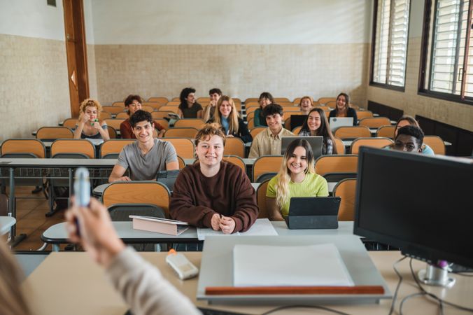 Diverse students listening to teacher