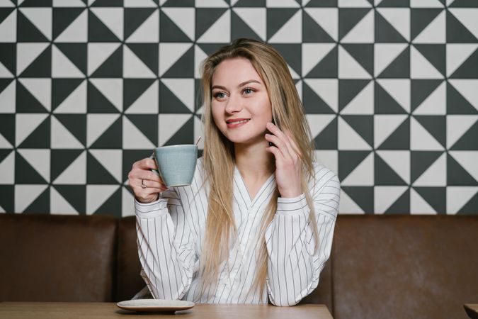 Young woman sitting at cafe