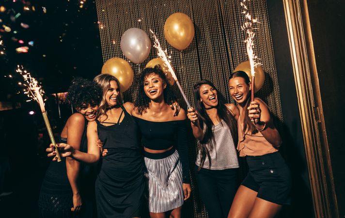 Female friends enjoying party at nightclub
