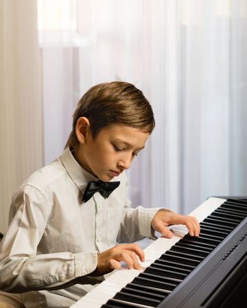 Young Boy's Piano Practice