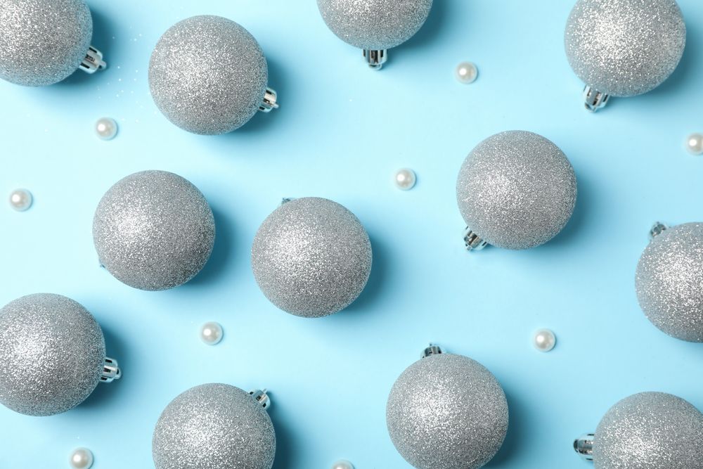 Christmas balls on blue background, top view