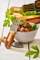 Bright vegetables with lentils and spinach in bowl