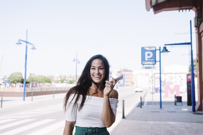 woman talking on mobile phone at street
