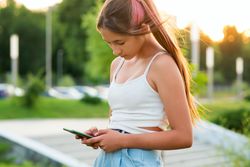 Teen girl using smartphone