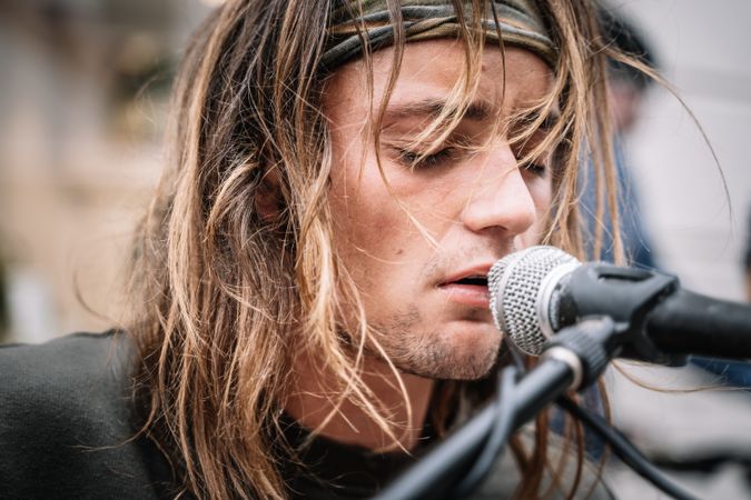 Male musician performing in the street